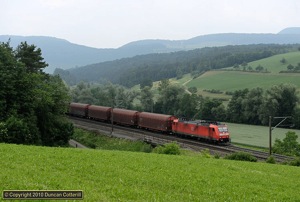 German Class 185s are very common on the main Swiss freight routes. 185.132 approached Zeihen with an eastbound freight on 15 June 2010.