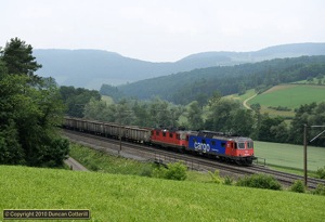 A typical SBB Cargo locomotive lash-up, an Re6/6 paired with an Re4/4 and known as an Re10/10. 620.012 and 11322 approached Zeihen with an eastbound train of scrap steel on 15 June 2010.