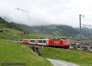 Westbound Glacier Express 905 climbed from Rueras to Dieni behind HGe4/4ii No.106 on 16 June 2010.
