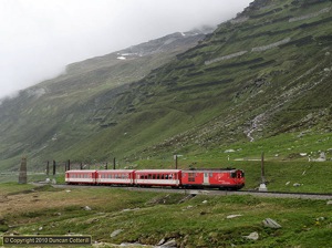 Motor Luggage Van No.55 had almost reached the top of the climb from Andermatt to Oberalppass when it was photographed working train 824, the 09:27 from Andermatt to Disentis/Muster on 19 June 2010.