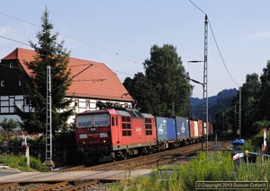 The line along the Elbe Valley between Dresden and Decin is home to DB's class 180 dual system electric locomotives, capable of working off German 15kV AC and Czech 3kV DC systems. 180.008 was photographed on an eastbound container train between Kurort Rathen and Königstein on 22 July 2010.