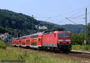 The old Königstein Güterbahnhof provides a good location to photograph trains. 143.883 rattled past with S-Bahn train 7033 to Bad Schandau on 22 July 2010.