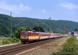 Residents of Wien wishing to visit the seaside can catch train EC378 at 05:50 from Wien Praterstern and arrive at the resort of Binz on the Baltic island of Rügen at 19:17. Just in time for a stroll along the beach before bedtime. 371.015 worked EC 378 past Königstein Güterbahnhof at 12:28 on 22 July 2010, about halfway through its long journey.