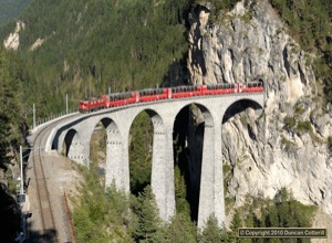 Ge4/4i 604 worked the Bernina Express back to Chur on 26 August 2010 and was photographed crossing the Landwasser Viaduct north of Filisur.