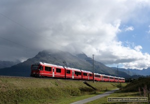 More a pile of junk than a pot of gold, ABe8/12 3503 left Samedan under stormy skies with train 960, the Davos section of the Bernina Express on 28 August 2010.