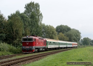 With the Luhacovice branch closed for engineering work, through trains from Praha were turning round at Ujezdec u Luhacovic. 754 066 passed Hradcovice with westbound Ex 526 on 10 September 2010.