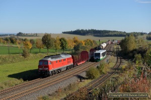 232.347 approached Reuth with the afternoon freight from Hof on 9 October 2010, just as a VBG 'Waschmaschine' scuttled out of the way on a Herlasgrün - Hof local.