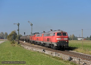 Triple headers aren't uncommon around Mühldorf. 217.021, 217.012 and 233.586 led an eastbound train of oil tanks through Pirach on 12 October 2010.