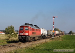 233.662 passed a fine set of semaphore signals as it left Pirach with an afternoon freight from Wackerwerk to Mühldorf on 12 October 2010.