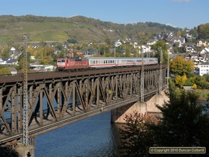 Orientrot 181.215 crossed the Mosel on the double-deck bridge at Bullay with IC336, the 08:34 Emden Hbf - Luxembourg, on 21 October 2010. 