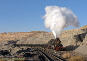 The chimney first coal trains from Xikengkou to Xuanmeichang were the highlight of our visit to Sandaoling. JS 8368 stormed out of the pit on the afternoon of 24 November 2010, bringing our visit to a very satisfactory conclusion.