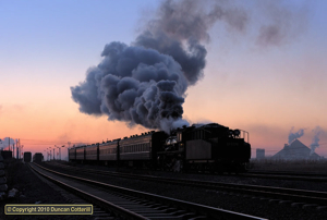 SY 1770 accelerated train 202 away from Sanjiazi, towards Diaobingshan, at dawn on 3 December 2010. The two eastbound trains at the left of the picture were both diesel hauled. 