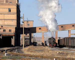 The buildings at the Zhuangmei washery provide an attractive backdrop to photograph steam locos against. SY 1441 shunted loaded wagons beside the loader on 8 December 2010.
