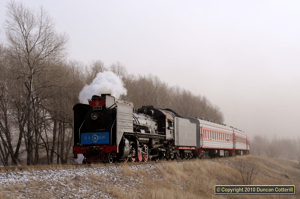 Gale force winds hit northern China on 10 December 2010, whipping up dust and turning the light brown. It was difficult to avoid being blown over when JS 6245 passed with the 14:00 passenger from Xizhan to Fengshuigou.