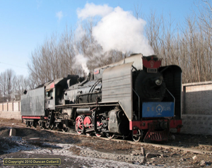 Yuanbaoshan still keeps its locos in excellent condition but they don't have a lot to do. JS 6245 basked in the winter sunshine at Xizhan on 11 December 2010. 