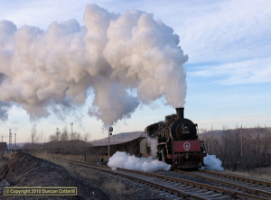 SY 1565 stormed out of Malin with empties to Homgmiao, just before sunset on 11 December 2010.