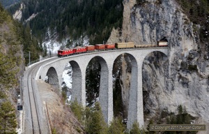 The light was becoming very weak when freight 5152 emerged from the tunnel onto Landwasser Viaduct on 16 February 2011. Unusually the train was hauled by a pair of Ge4/4is, 607 and 608, both working.