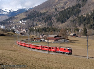 625 left Ilanz with RE1241, the 10:45 from Disentis/Muster to Scuol-Tarasp, on 17 February 2011. There wasn't much snow at lower levels during the first few days of my trip.
