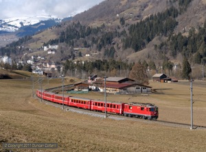 625 left Ilanz with RE1241, the 10:45 from Disentis/Muster to Scuol-Tarasp, on 17 February 2011. There wasn't much snow at lower levels during the first few days of my trip.
