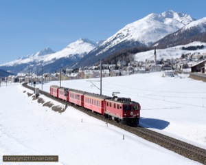 After numerous attempts to get a Ge4/4i at this location in good light I finally succeeded on 19 February 2011, capturing 602 working train 1936 towards S-chanf. 