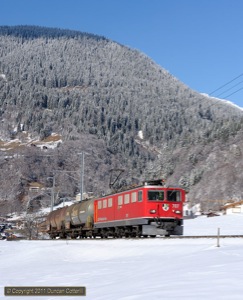 The afternoon freight from Landquart to Davos approached Klosters behind 707 on 23 February 2011.