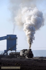 JS 8078 made a more typically vigorous departure from the loader with a loaded coal train.