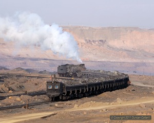 A typically grubby JS 8368 pushed a loaded spoil train out of the pit.