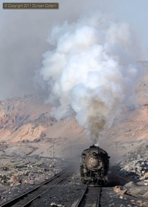 JS 8173 made a fine sight as it raced away from Xikenggou with a loaded coal train