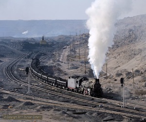 JS 8077 restarted its train after being held at signals.