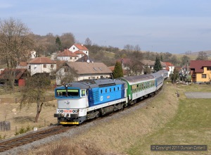 754.067 passed Polichno with Ex526 the 10:15 from Luhacovice to Praha hl.n., on 25 March 2011. 