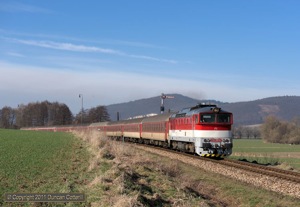 750.201 worked R721 north from Bystricany on the morning of 28 March 2011. The train is a through Bratislava - Prievidza service, diesel hauled for the last 95km from Leopoldov.