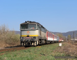754.056 approached Strazske with Os8906, the 09:35 from Humenne to Kosice, on 3 April 2011.