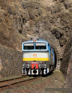 750.300 looked good emerging from the tunnel at Horny Turcek, south of Turcek, with Os7551, the 11:06 from Vrutky to Zvolen via Kremnica, on 9 April 2011.