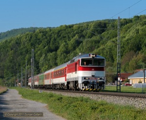 Immaculate 754.053 worked Ex221, the 11:17 from Praha hl.n. to Zvolen os.st. past Ilias, south of Radvan, on 4 May 2011.