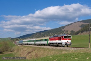 754.053 descended from Telgart towards Cervena Skala with R810, the 14:52 from Kosice to Bratislava, on 5 May 2011. Like R811, this train operates with CD stock.