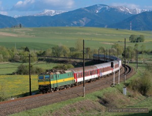 163s work most local services on the Zilina - kosice main line but it's unusual to see one on an express. 163.114 worked R1504, an additional Sunday service from Humenne to Bratislava, around the big curve west of Liptovska Vlachy on 8 May 2011.