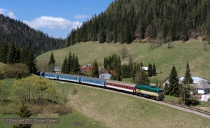 The third engine that appeared regularly on R810 and R811 was 754.055, another spotless machine in an attractive livery. It was photographed descending through Stratena with R811 on 9 May 2011.  