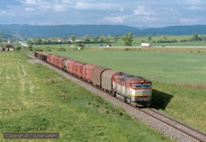 751.125 crossed the plains north of Tornala with a long southbound freight on 9 May 2011. The train had just passed the halt at Gemer.