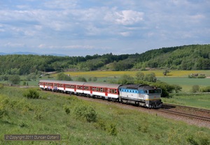 750.203 passed Slatinka on the climb out of Zvolen with Os6215, the 14:42 to Filakovo, on 12 May 2011.