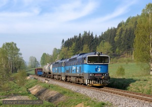 The same two locos worked north with a short freight the following morning. 753.763 and 753.762 were photographed north of Oldtichov v Hajich on 29 April 2011.
