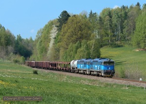 753.762 and 753.763 emerged from the deep cutting south of Mnisek u Liberce with a southbound freight on 30 April 2011.