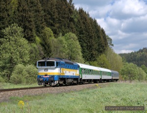 The end of class 749 operation on the Jesenik line was a blow but at least some of the most attractive 754s replaced them. 754.028 carries Plzen depot's trademark blue, white and yellow livery and was photographed south of Potucnik working train R904 on 13 May 2011.
