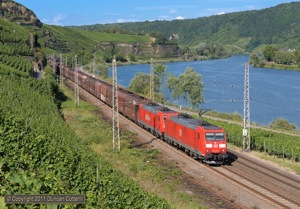 Almost any DB freight power could turn up on coal trains but 185s were most common. 185.040 and 185.214 worked a loaded train south near Winningen on 8 July 2011.