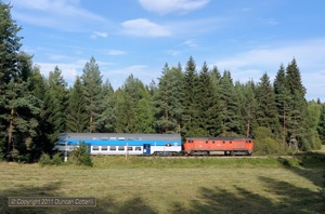 The shadows of nearby trees were racing towards the track east of Stozec by the time 749.252 began it's journey back to Ceske Budejovice with Os8127/8126, the 17:17 from Nove Udoli.