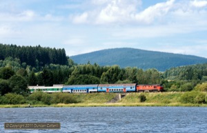 749.252 ran along the north shore of the Lipno Reservoir, west of Cerna v Posumave, on its way back to Ceske Budejovice with Os8119/8118, the 13:17 from Nove Udoli, on 12 August 2011.