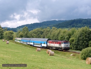 On a cloudy day it's extremely rare for a short break in the clouds to coincide with the passage of a train. Fortunately it happened when 749.256 approached Horice na Sumave with Os8119/8118, the 13:17 passenger from Nove Udoli to Ceske Budejovice, on 13 August 2011.