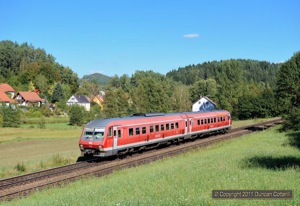The freight I was waiting for at this spot near Lehendorf, west of Etzelwang, was very late and the light had gone round too far before it arrived. 610.019, working RE3533, the 15:02 from Neustadt(Waldnaab) to Nürnberg,  provided a tolerable alternative subject for a photo. 12 September 2011.