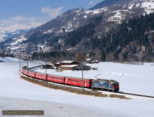 619 is the only Ge4/4ii in an attractive non-standard livery, celebrating the Berninabahn's hundredth anniversary. The loco was photographed near Ilanz on RE1245, the 11:44 Disentis - Scuol-Tarasp, on 4 March 2012.