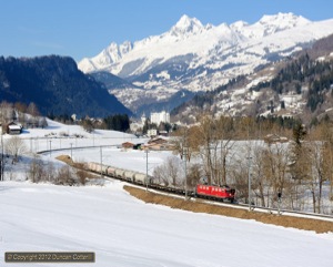 The weather was far better on 7 March 2012. 704 was photographed between Ilanz and Castrisch with freight 5236 from Disentis to Landquart, consisting mainly of empty cement tanks from the Gotthard Base Tunnel workings at Rueras, near Sedrun.