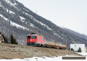 618 worked a number of trips from Pontresina to Serneus, near Klosters, and back with swap bodies. The loco was photographed at Bever on the return trip on 8 March 2012.